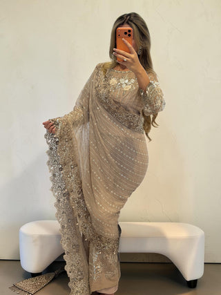 Emaara Luxe Arielle Saree in beige with intricate floral embroidery, sequin detailing, and a pre-hooked design.